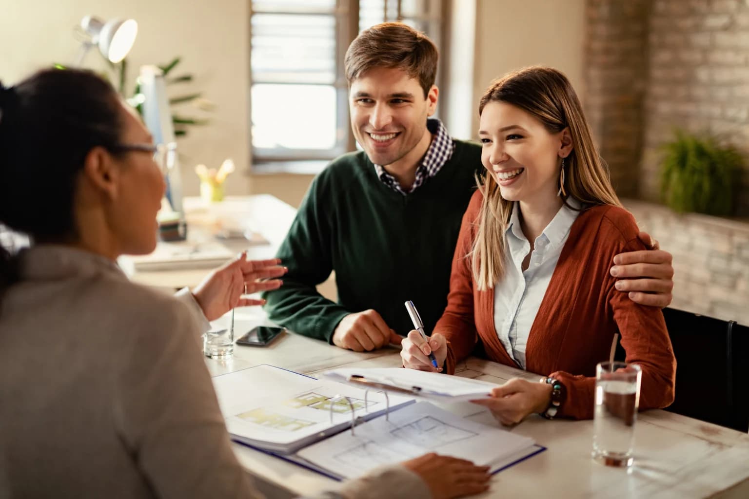 Couple reviewing a property purchase with their Liviti adviser