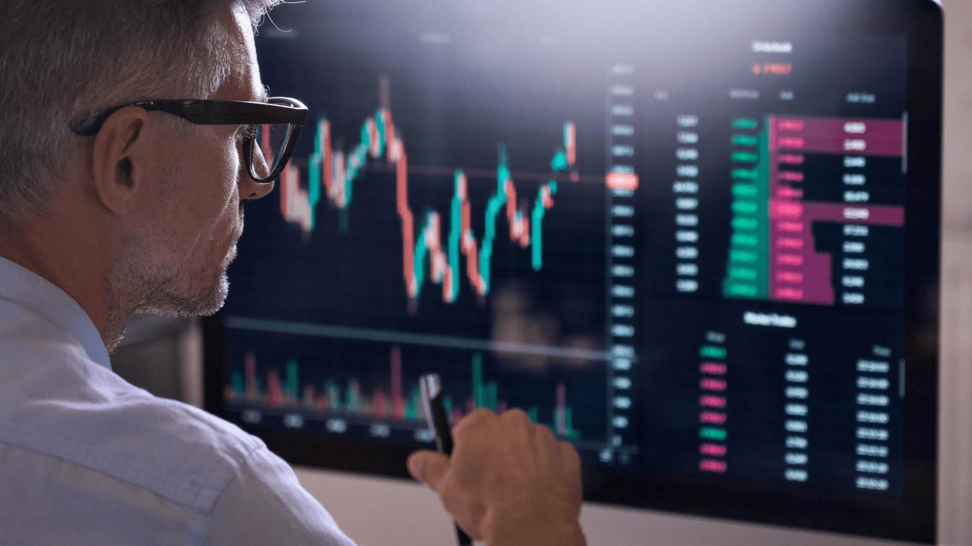 man looking at rates go up and down