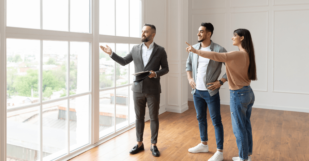 Off the plan - a broker showing a property to a couple