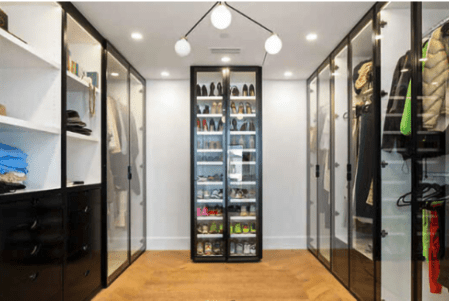 Source: Alexis Adam - Image of black lacquer cabinetry in custom closet