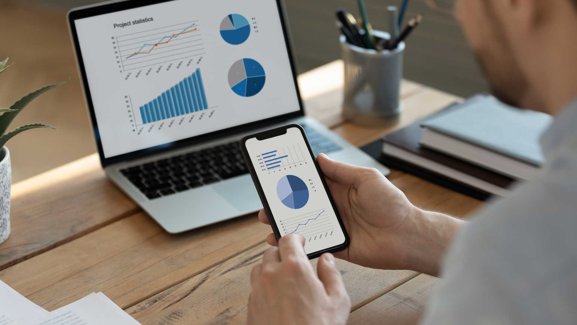 6 step guide to property investment portfolio success unlocking maximum returns image 2 - person looking at data on his phone