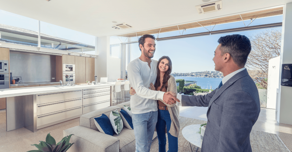 Australian Real Estate Market - Couples handshaking with a property broker for having a successful property deal