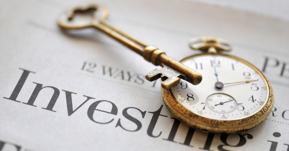 Property Investment - A Paper Indicating Investments and there is a stopwatch and door keys over the paper 