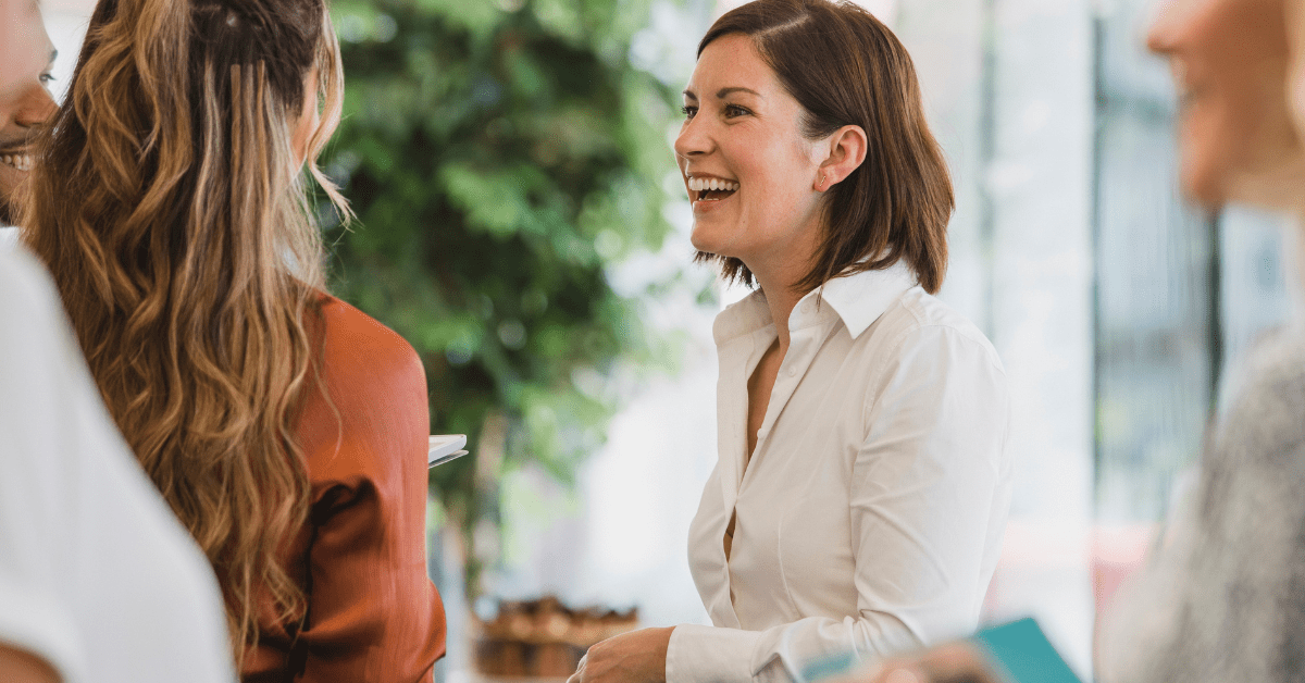 Property Investor - Image of women smiling while talking with each other