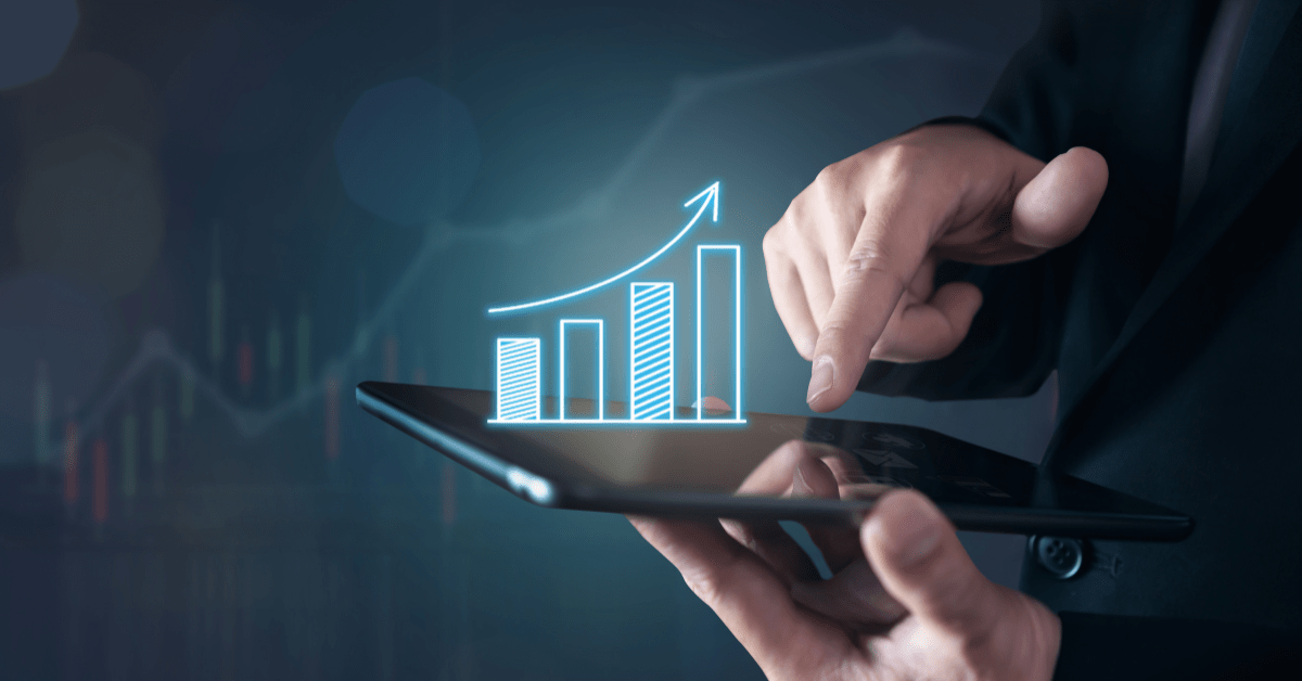 Property investors showing growth on 3D diagram on a tab using a pen