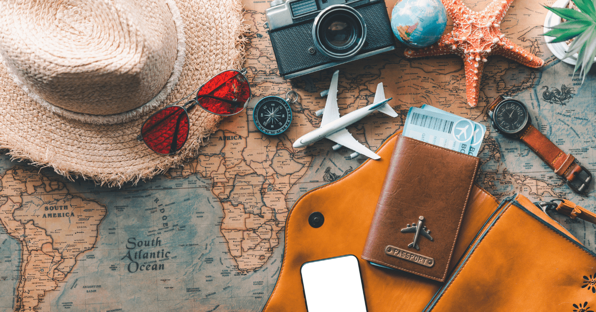 Travel Through Property Investment Income - Map with passport, a campus and a sunglass on it