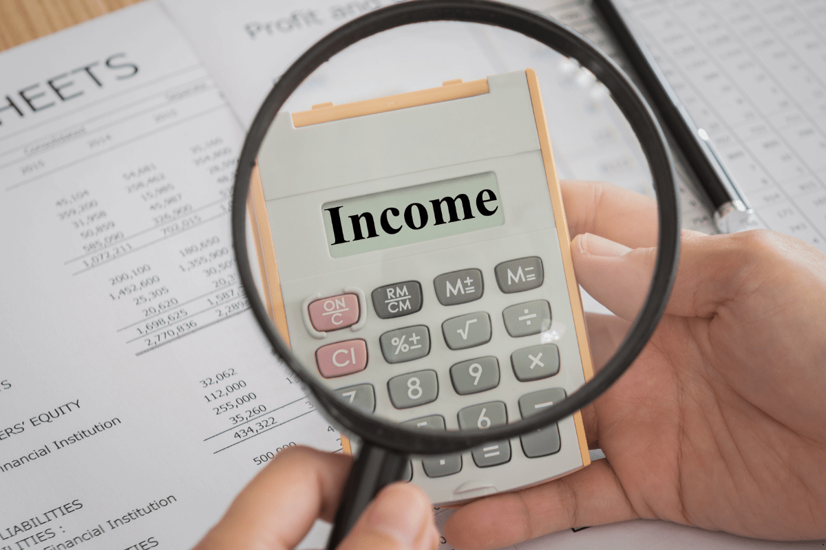 Investment property income with magnifying glass