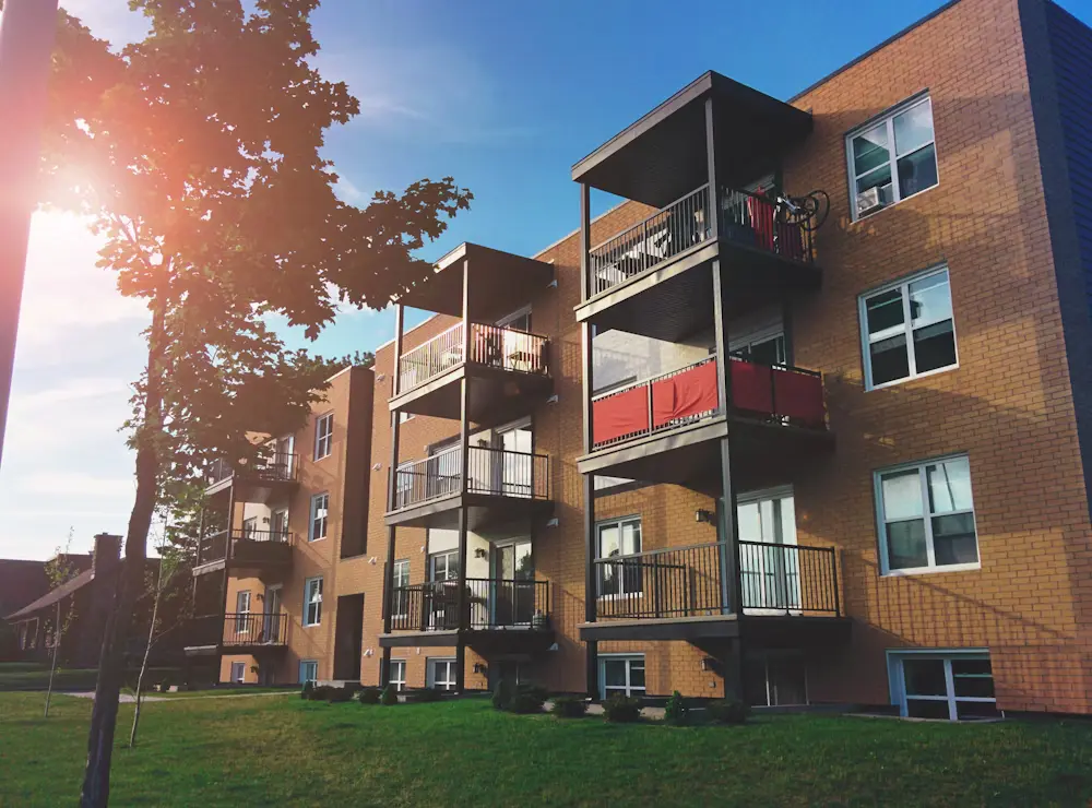 Old Vs New Apartments - image of a new building with bricks in a sunny day