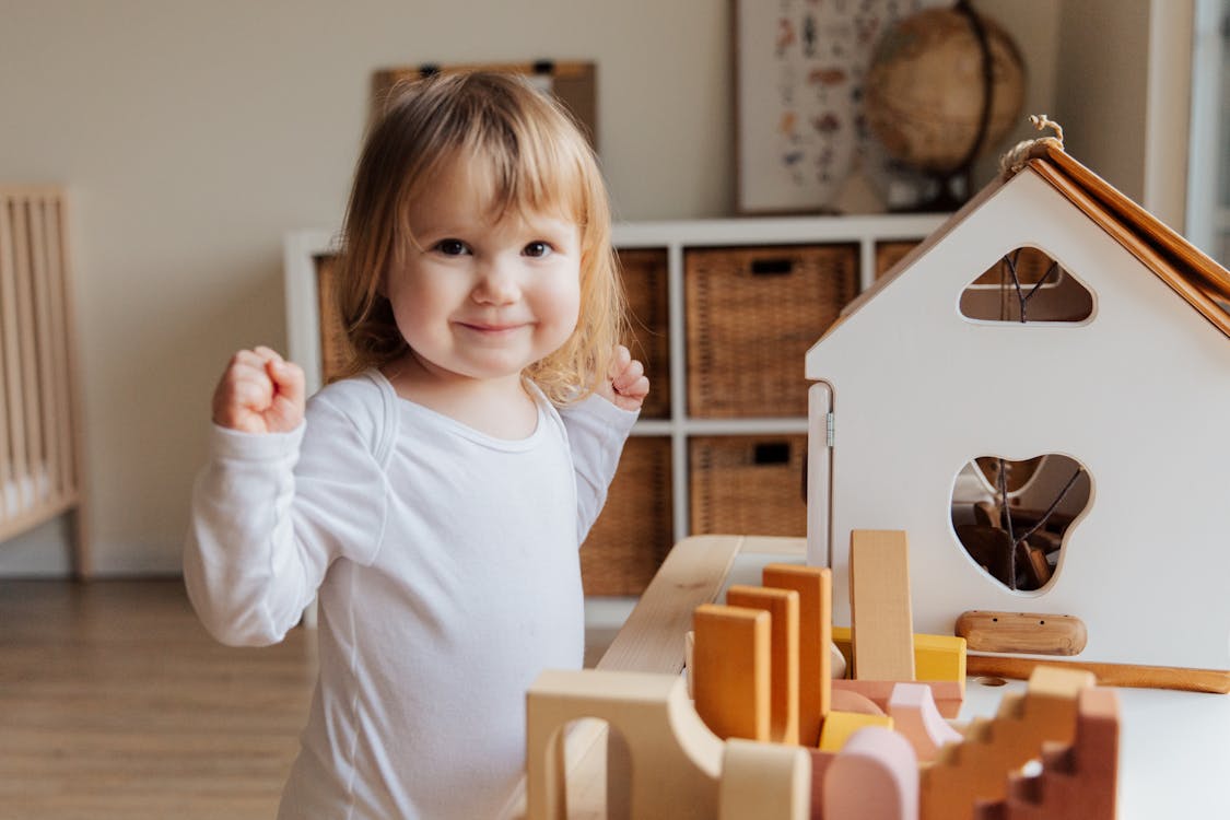 Free Girl Playing Inside Her Room Stock Photo