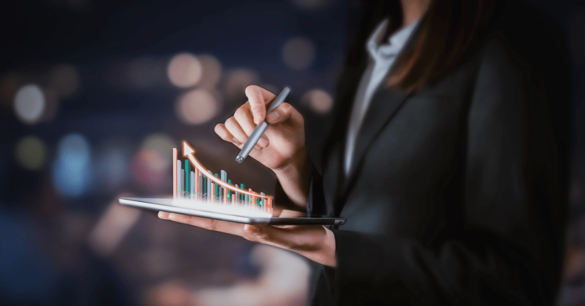 Investment Strategies - A person showing growth on 3D diagram on a tab using a pen