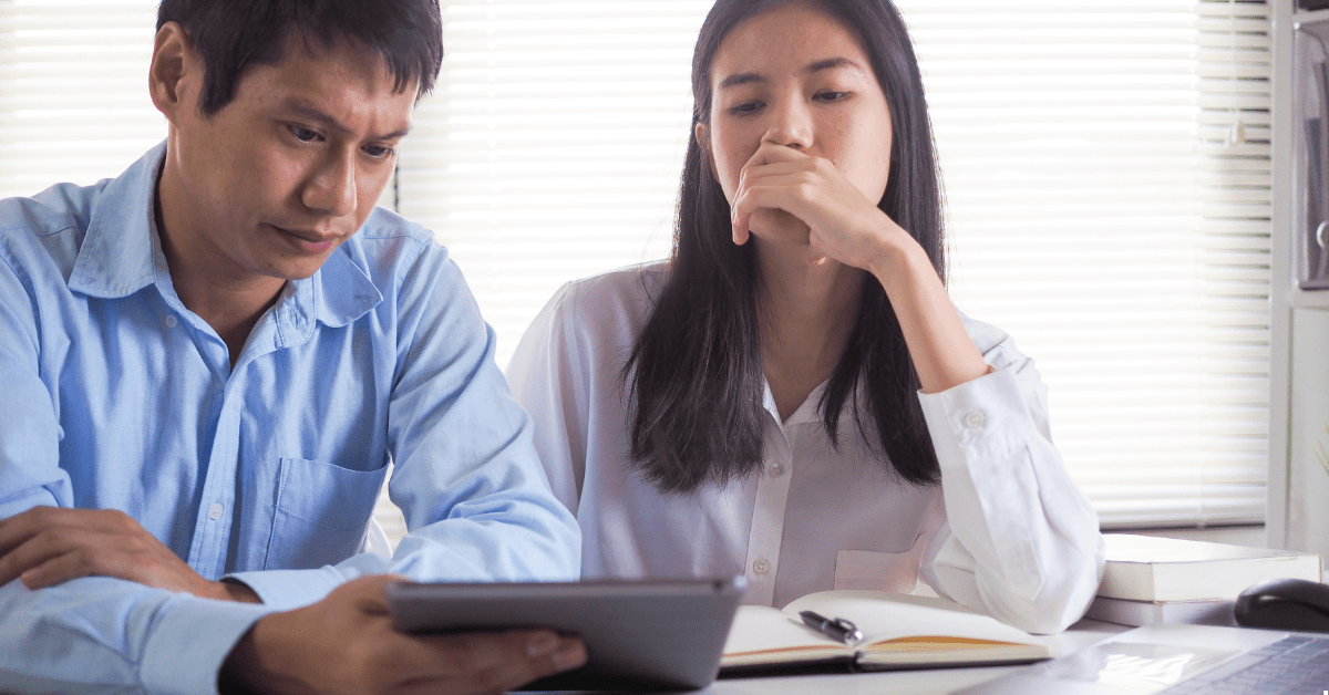 SMSF investment Property - Two Persons seeing on a iPad screen thinking something