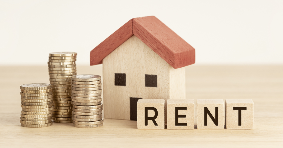 House Hacking Strategy for Investment properties - Dummy house with coins and blocks mentioning the word RENT