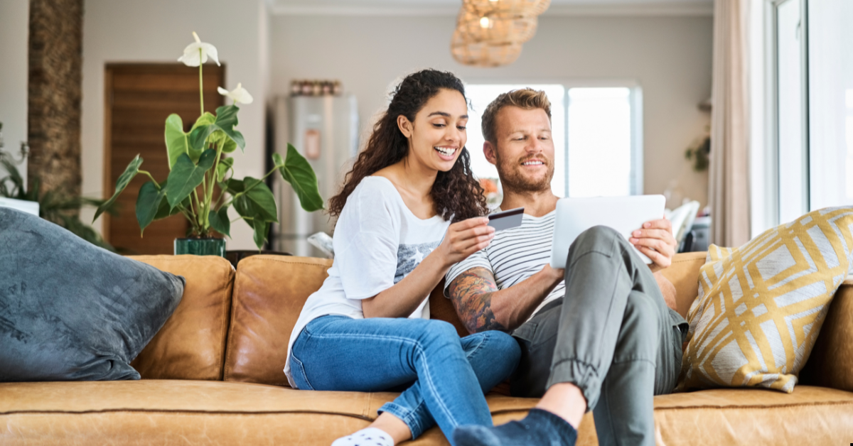 Wealth building through property - couples looking at displays and feeling happy