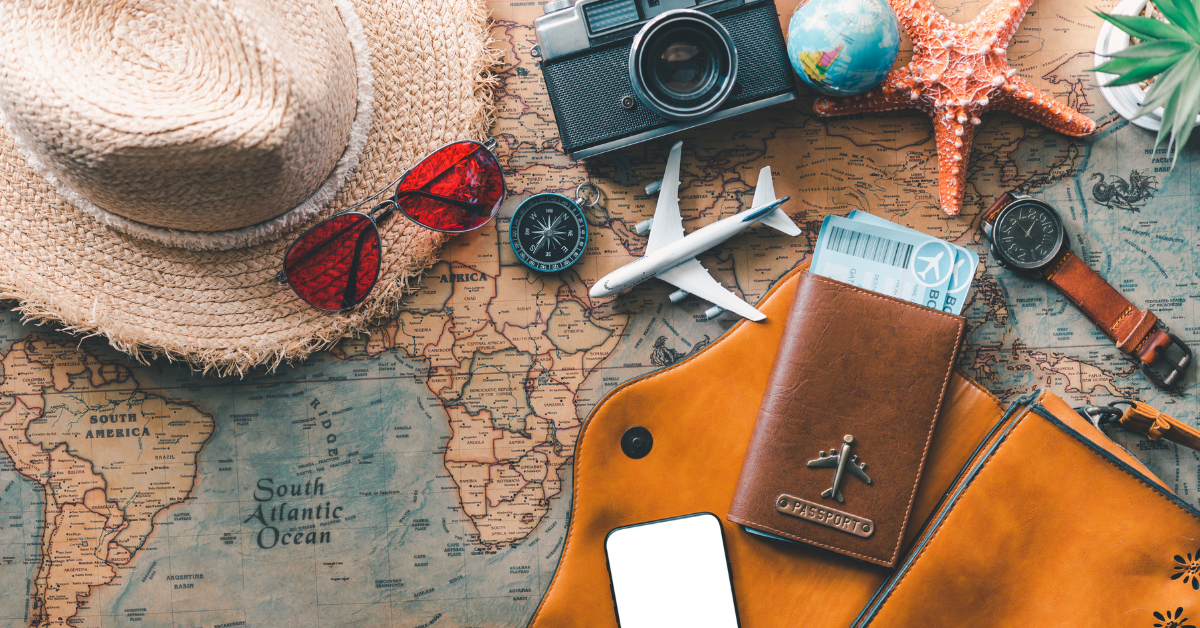 Travel Through Property Investment Income - Map with passport, a campus and a sunglass on it