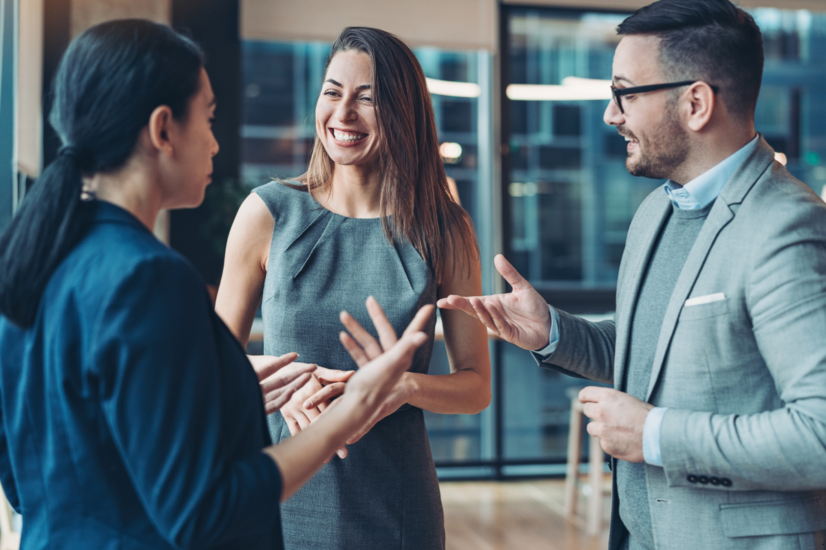 3 persons making networks with each other by talking